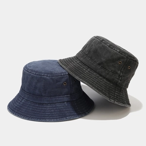 Faded washed denim bucket hats in navy and charcoal with vintage distressed details