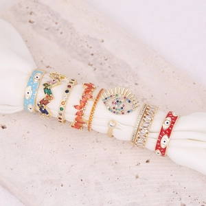 Bohemian gold evil eye ring set with colorful zircon and enamel inlay details