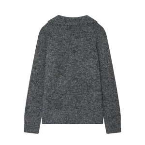 Detail of heather grey knit sweater showing soft texture and ribbed hem construction