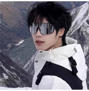 Detail of silver mirrored sports sunglasses with oversized frame for outdoor hiking