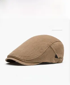 Detail shot of the khaki canvas beret featuring adjustable metal buckle and stitching