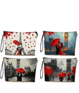 Detailed pattern display of Paris Tower cosmetic bags with red umbrella accent and wristlet