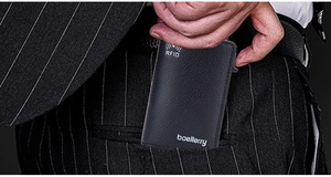 Slim RFID blocking lychee leather card holder being placed into a suit pocket