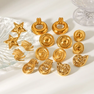 Close-up of vintage 18K gold plated stainless steel earrings in various geometric shapes