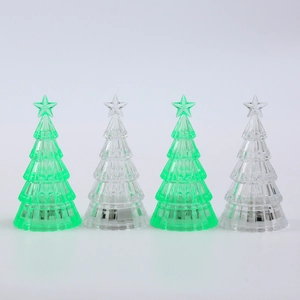 Set of four glowing crystal mini Christmas trees with LED night lights for desk decoration