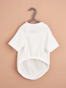 Detail of white mesh pet t-shirt hanging on a pearl hanger with breathable fabric texture