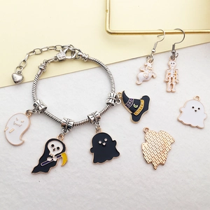 Detailed set of Halloween charms including enamel ghost and witch hat on silver chains