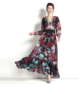 Detail of deep V-neck and vibrant floral print on elegant black long sleeve maxi dress