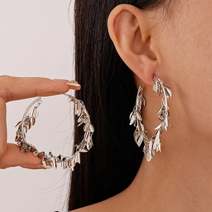 Silver metallic leaf fringe hoop earrings for women in a minimalist bohemian style