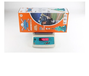 Detailed view of dinosaur baseball launcher set in packaging showing weight on scale