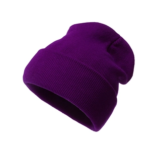 Deep purple knitted beanie hat with ribbed cuff for winter warmth and fashion style