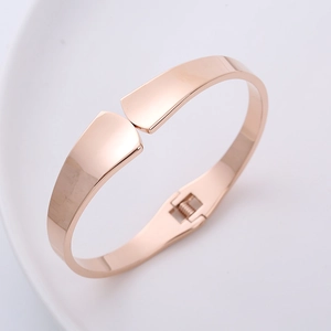 Polished rose gold fan-shaped hinged bangle bracelet with smooth spring design