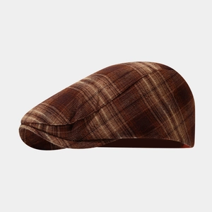 Classic British style brown plaid flat cap for men and women in vintage newsboy fashion