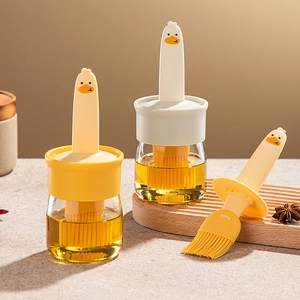 Duck-shaped glass oil dispenser bottle set with silicone brush for kitchen and BBQ cooking