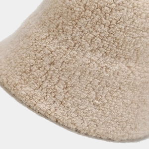 Close-up of beige wool blend bucket hat showing soft lamb fleece texture and warm fibers