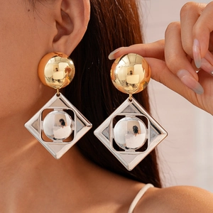Chic geometric gold and silver mixed metal earrings featuring spheres and diamond frames