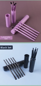 Detail of 5-piece makeup brush set with storage tube in Blush Pink and Forest Black