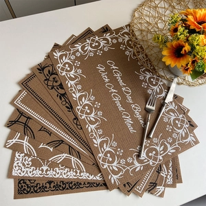Brown faux linen placemats with floral patterns and a good meal greeting message