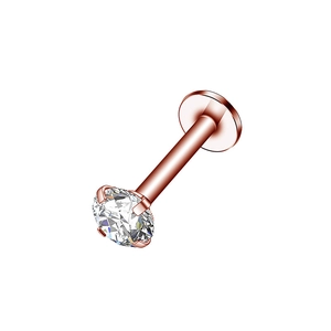 Detailed macro view of rose gold labret stud with four-prong set sparkling round zircon