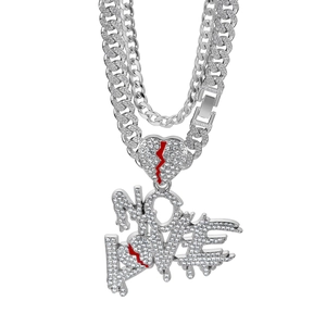 Detailed macro view of iced-out NO LOVE pendant and Cuban link chain set