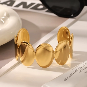 Polished 18K gold-plated oval cuff bangle for women with a minimalist luxury finish