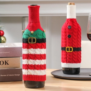 Striped knit Christmas wine bottle covers featuring Santa and Elf holiday designs