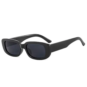 Vintage retro square sunglasses with thick black frames and dark lenses in a side view