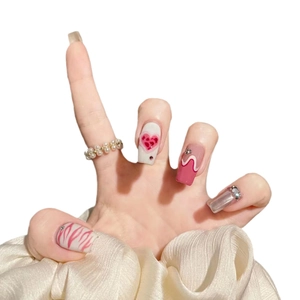 Pink heart and zebra flame press-on nails in long coffin shape with glossy rhinestones