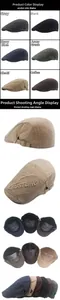 Detail of adjustable metal buckle and letter embroidery on cotton newsboy cap