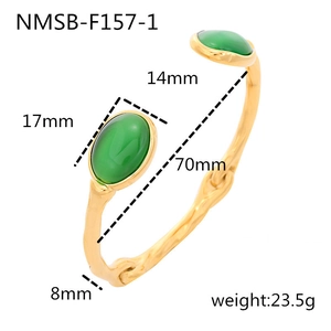 Detail view of wavy gold titanium steel bangle with green oval stones and size specs