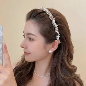 Elegant acrylic wave headband with irregular crushed stones on a fashion model