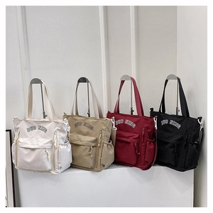 Large capacity nylon tote bags in beige, khaki, burgundy, and black with multi-pocket design