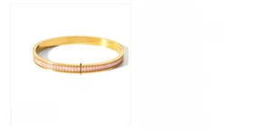 Close-up of 6mm wide 18k gold plated stainless steel bangle with pink zircon stones