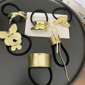 Set of six gold metal punk style ponytail hair ties with geometric and butterfly designs