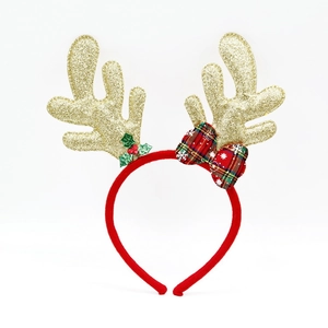 Detail of red Christmas headband with glitter reindeer antlers and a plaid bow decoration