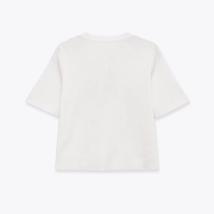 Back view of a white round neck knitted top showing fine texture and soft fabric