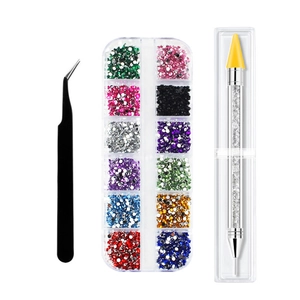 Detail view of 12-grid colorful acrylic rhinestone set with tweezers and wax dotting pen
