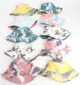 Collection of ten colorful tie-dye bucket hats in various patterns on white background