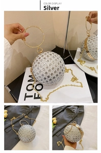 Detailed view of silver spherical evening bag with sequins and gold metal handle