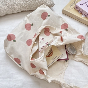 Top view of peach print canvas tote bag showing inner capacity and soft cotton fabric