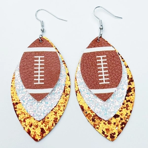 Detail of layered teardrop earrings with brown football pattern and glitter layers