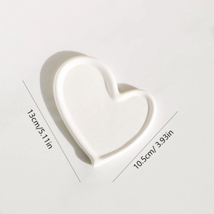 Minimalist white heart ceramic jewelry tray display measuring 13cm in length