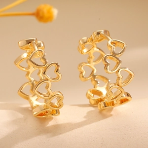 Goldene Herz-Ohrringe mit Ausschnitt-Design und minimalistischem Tropföl-Stil für Damen
