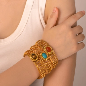 Gold vintage coiled cuff bracelet set with natural red agate and turquoise stones