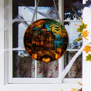 Close-up of Halloween acrylic hanging ornament with a pumpkin haunted house design