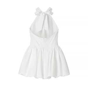 Elegant white halter neck dress featuring a large satin back bow and backless silhouette