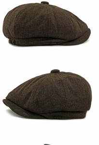 Detailed view of brown herringbone wool newsboy cap showing classic textured fabric