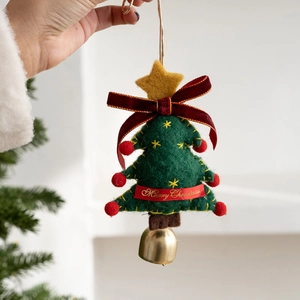 Green felt Christmas tree ornament with red ribbon bow and a golden metal bell