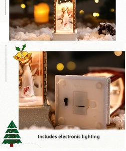 Detail of glowing Christmas angel decoration with snowy finish and battery compartment