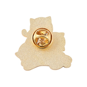 Back view of Gengar-shaped cartoon pin in gold-plated metal with classic butterfly clasp